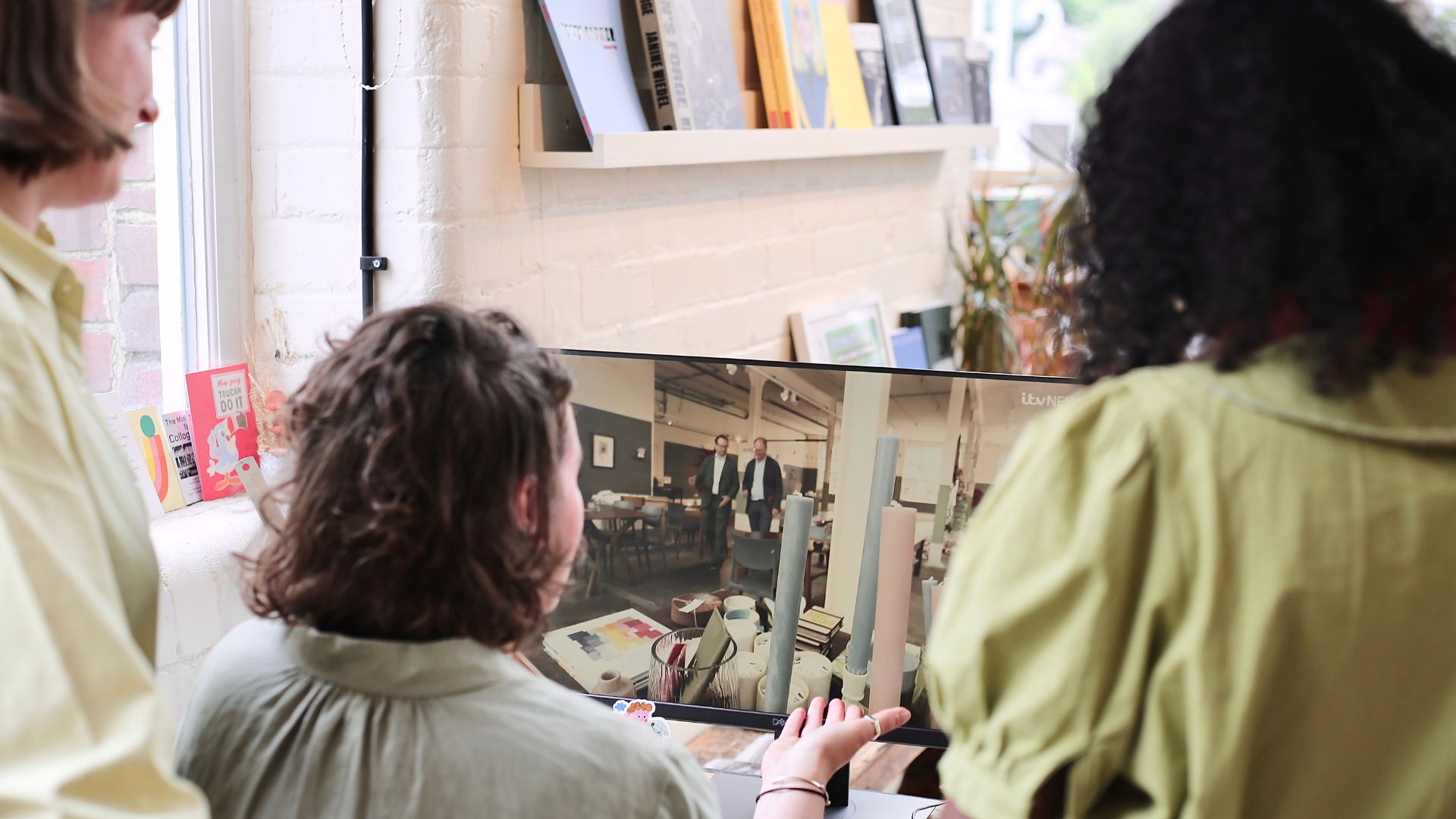 Sunny Bank Mill employees watching the ITV News video on Sunny Bank Mills.